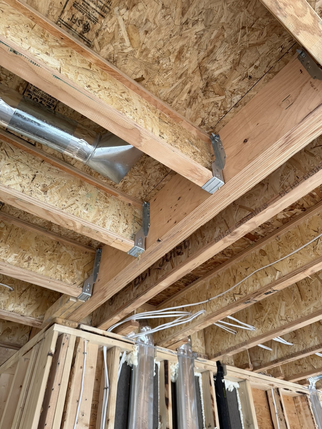 Interior wood framing and structural beam connection detail