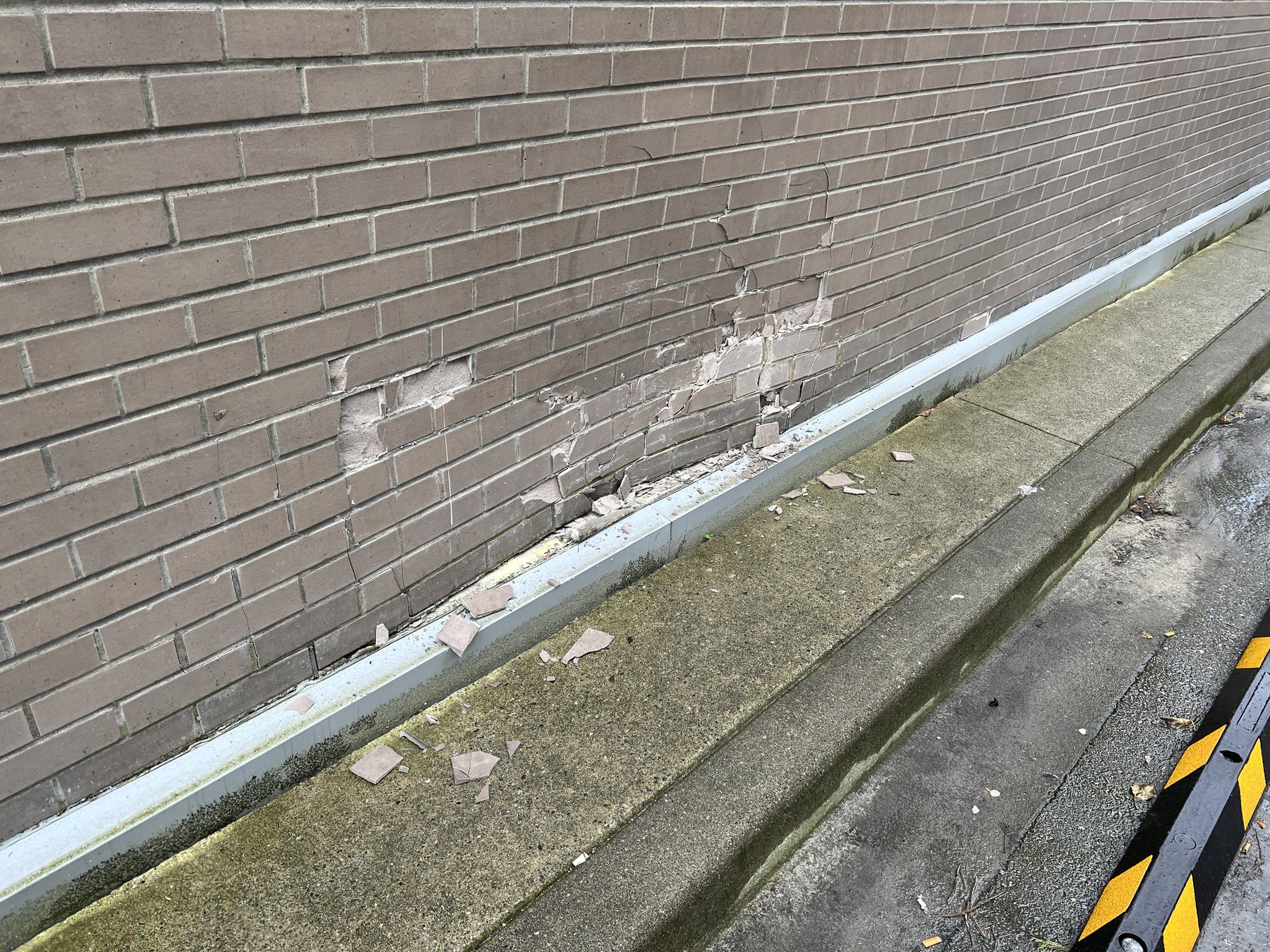 Brick wall damage requiring structural restoration review